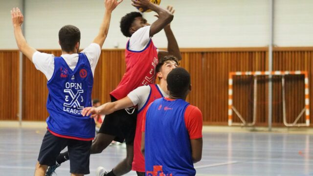 Basketball players competing for the ball during a game